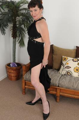 15P Over 30 lady Anna D removes a long black dress before a close up of her snatch