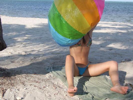 16P Petite sexy babe stripping on the beach and spreading her sweet cunt
