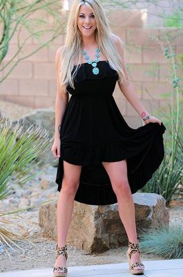 15P Happy busty blonde Gisele drops her black dress to pose naked outdoors