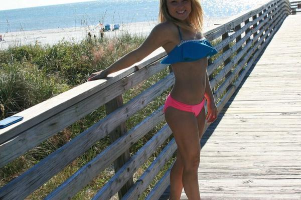 15P Blond amateur Meet Madden goes for a walk on the beach and boardwalk in bikini