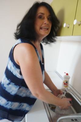 18P Older housewife Ria Black strips after washing up dishes to finger her pussy