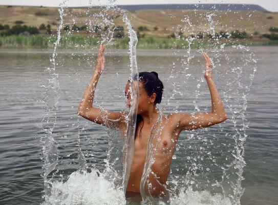 16P Ingaa playfully splashes the water and flaunts her sexy bikini tan lines by
