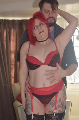 16P Middle-aged redhead and her man friend kiss after getting mostly naked