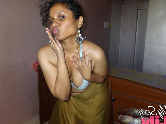 16P Indian woman lets a boob slip loose from her bra while being a tease