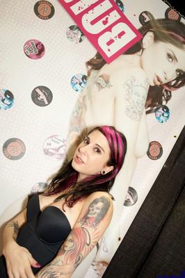15P Tattooed girls kiss and hump while attending an adult industry convention