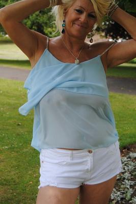 18P Hot mature Platinum Blonde spreading legs in shorts on blanket under the trees