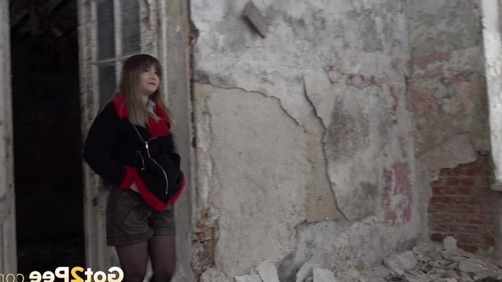 15P Nervous European relieves herself in old building