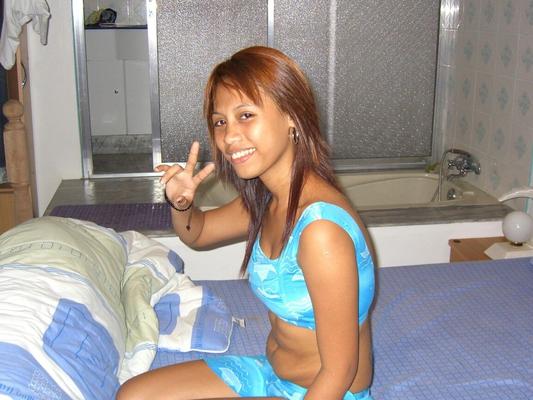 14P Filipina redhead sticks out her tongue before making her nude modelling debut