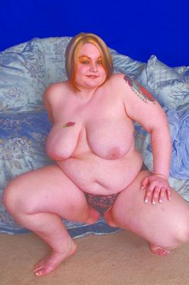 15P Fat redhead spreading her pink vulva