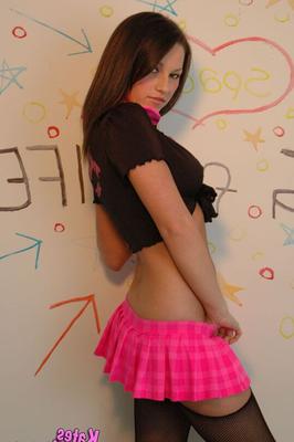 12P Young amateur Kate teases in a ruffled pink microskirt plus a thong and nylons