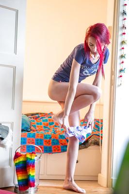 16P Voyeur footage of redhead amateur babe Ioana dressing hairy pussy