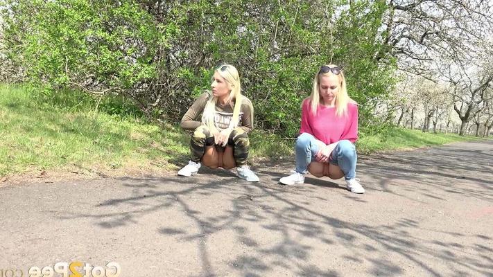 15P Blonde girls Debora & Vanessa Hell squat to pee on a path while out for a walk