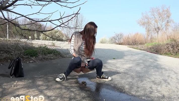 15P Outdoor pissing for hot brunette Cynthia