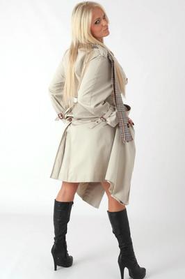15P Platinum blonde chick Charlie G removes an overcoat to model lingerie in boots