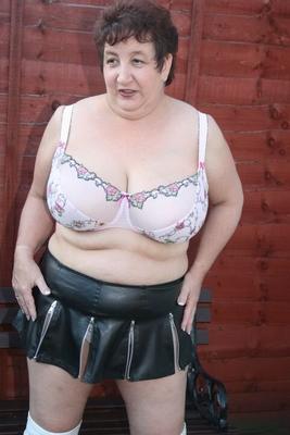 16P Overweight mature amateur Kinky Carol uncovers her saggy boobs in OTK boots