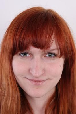 15P Natural redhead Alexandra stands naked before showing her shaved vagina