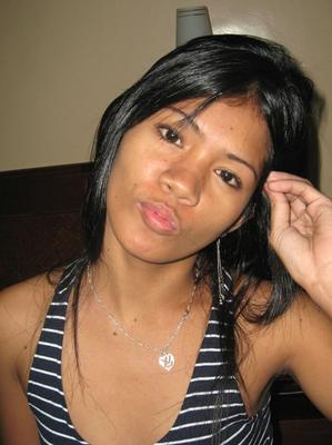 14P Filipina amateur strips to a strapless black bra and thong on a hotel room bed