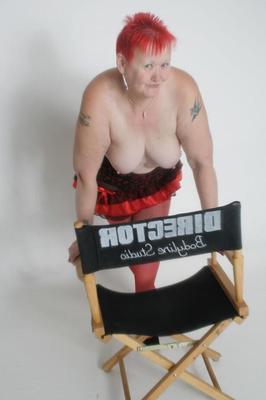 20P Fat granny Valgasmic Exposed sports short red hair while showing her huge ass
