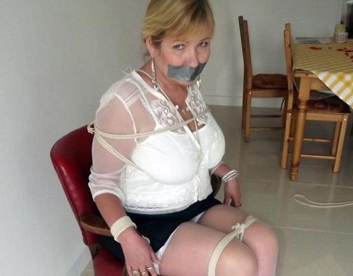 16P Blonde woman is silenced with duct tape while her tits are bound with rope