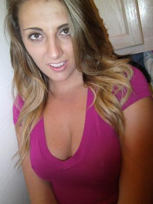 21P Sweet babe with a round booty Brooke B exposes her big tits in a solo
