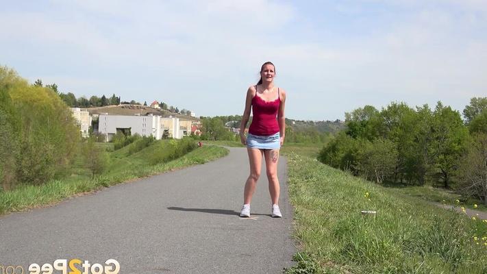 15P Caucasian girl Amanda Hill pisses on a paved roadway while out for a jog