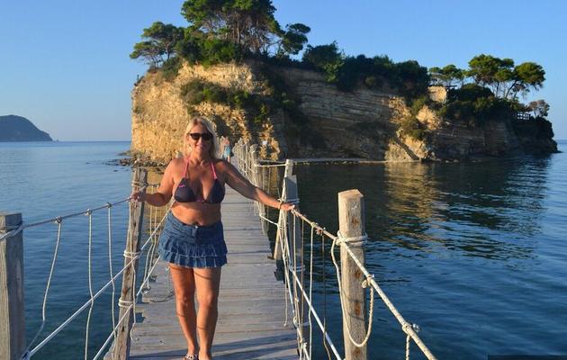19P Hugely busty mature slut Chrissy swims and lounges at the beach stark naked