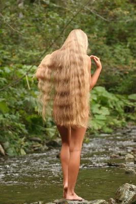 21P Young babe with an adorable ass Marin poses naked deep in the woods