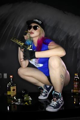 12P Blonde chick Leya Falcon holds pistols & booze while showing her tits and twat