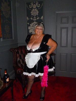 20P Fat old maid Grandma Libby doffs her uniform to pose nude in stockings