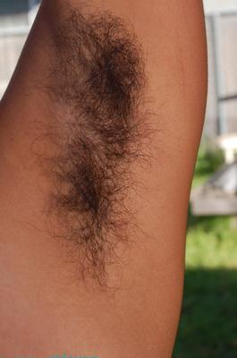 21 Pics Classy ebony hottie Sonya strips outdoors & reveals her hairy armpits & pussy