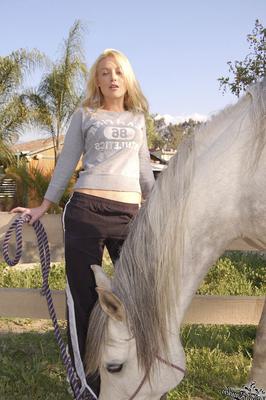 20 Pics Blonde American MILF Kayden Kross plays with her horse at the ranch