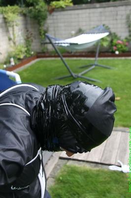 16 Pics Amateur woman Sandra is gagged and tied to a pool in a raincoat