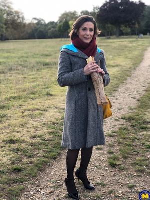 20 Pics French mom Anya flashes her legs in stockings while eating a sandwich outside