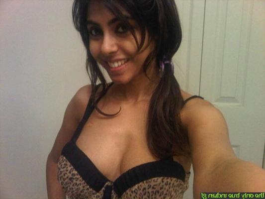 10P Pretty Indian girl uncovers her nice tits while taking self shots in a mirror