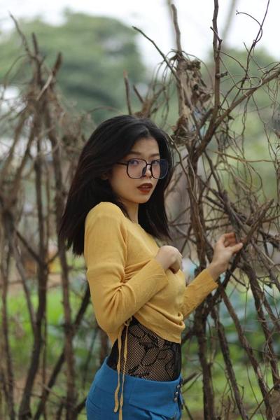 20P Little Asian babe with glasses Irena teasing in her provocative outfit outside