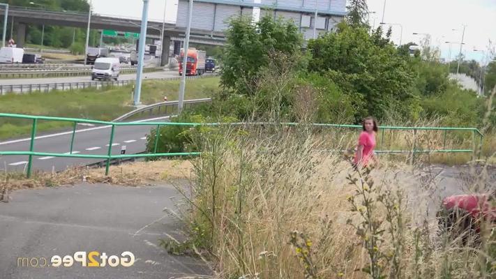 15P Caucasian girl Vicoria Daniels pisses on a paved path while out for a walk
