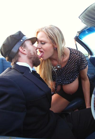 18P MILF Kelly Madison exposes her big tits & kisses her driver on the highway