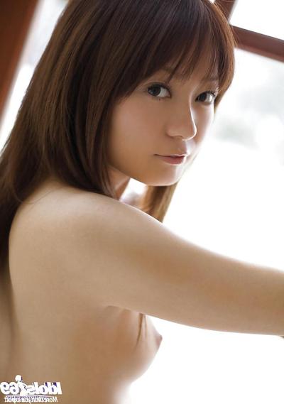 16P Pretty asian coed with unshaven pussy slipping off her clothes