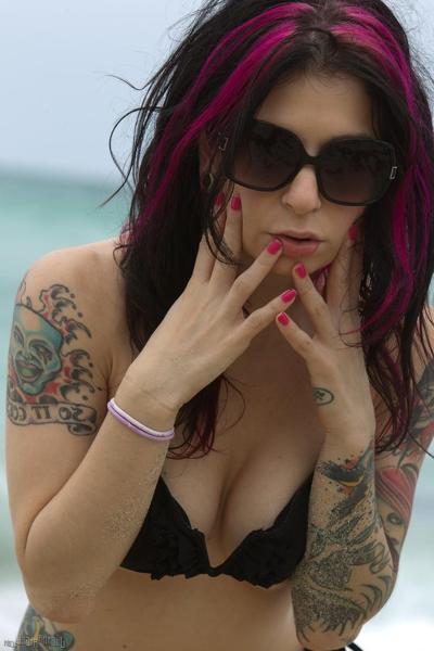 17P Tattooed model poses non nude at the beach in a bikini and sunglasses