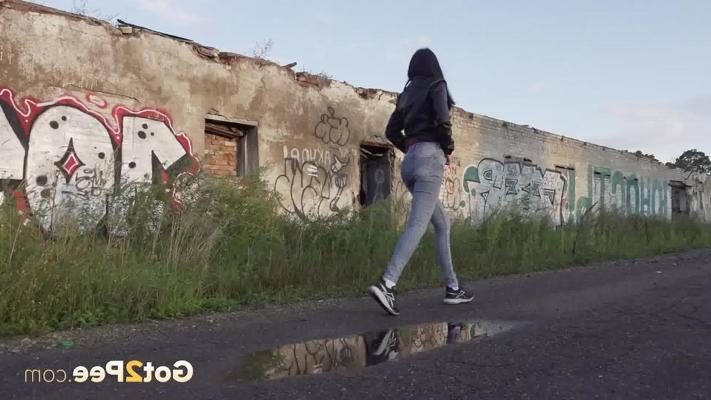15P Petite brunette Natasha squats for a piss in a puddle on a gravel road