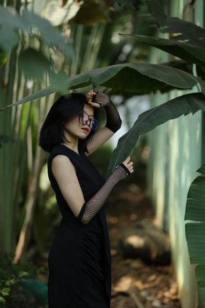 20P Petite Asian babe with glasses Irena posing in her long black dress outdoors