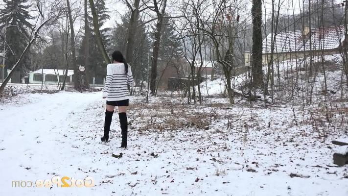 15P Dark-haired girl Esperansa pees on a snow-covered bench in over the knee boots