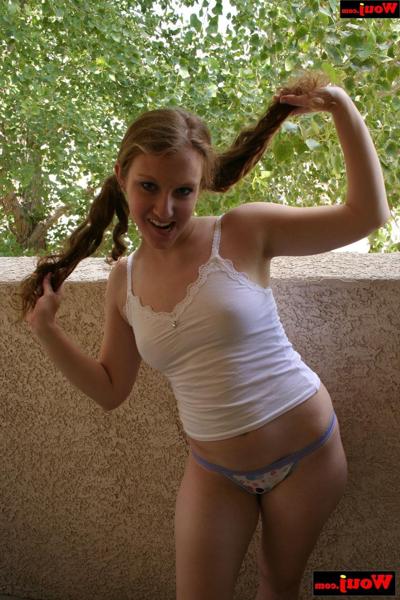 15P Amateur babe grabs her pigtails while posing in her shirt and panties