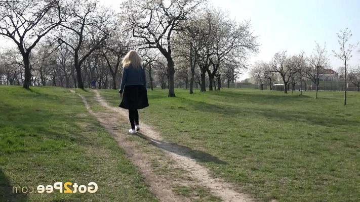 15P Blonde girl Debora takes an urgent pee on a dirt path through an orchard