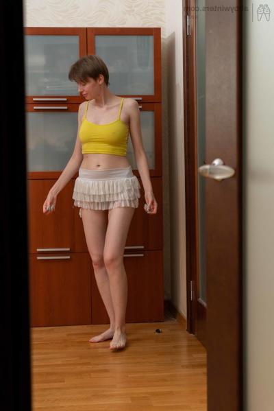 20P Sweet short haired amateur Erina gets spied on while dressing in a solo