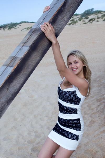 20P Sweet teen with blue eyes Luciana A unveils her natural tits on the beach
