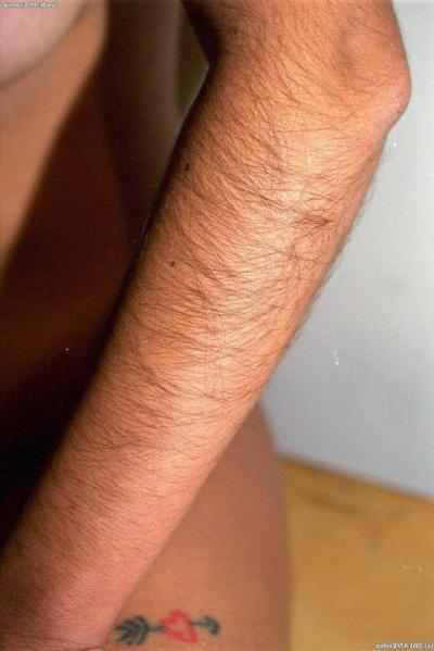 20P Gorgeous brunette Gloria shows her tanned tits & her inviting hairy pussy