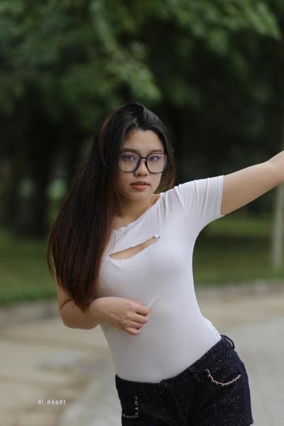 20P Nerdy Asian model Natalia posing in her sexy tight outfit outdoors