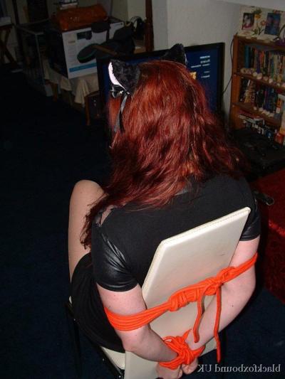 16P Thick redhead is tied to a chair with tape affixed to her mouth