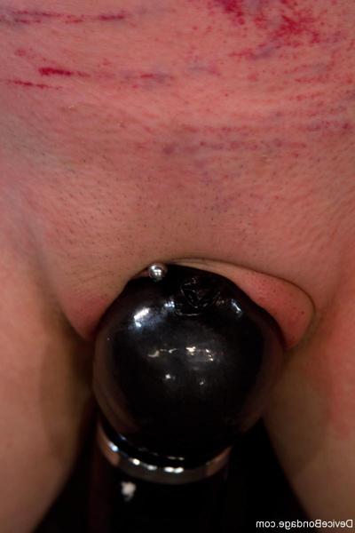 20P Masked slave girl Sloane Soleil gets toyed while standing in metal bondage